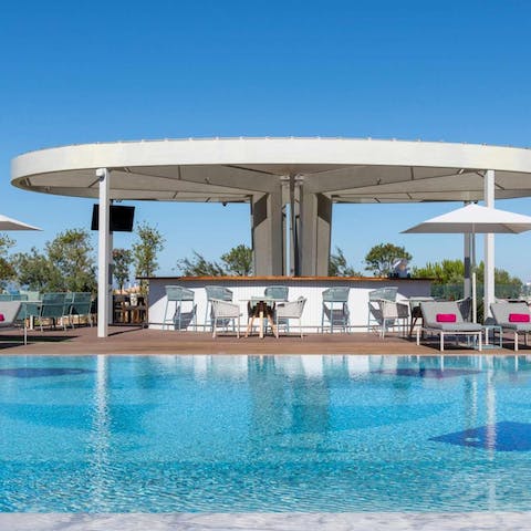 Take a dip in one of the resort's communal swimming pools 