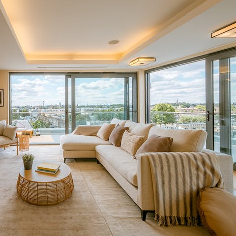 Enjoy expansive views across east London whilst relaxing in the living room