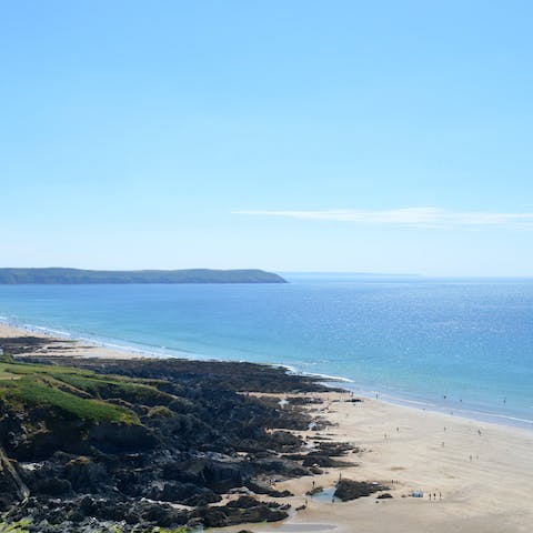 Stroll down to the sandy shore of Woolacombe Beach
