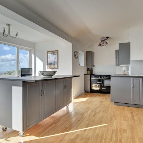 Cook for your guests in the modern kitchen with sea views