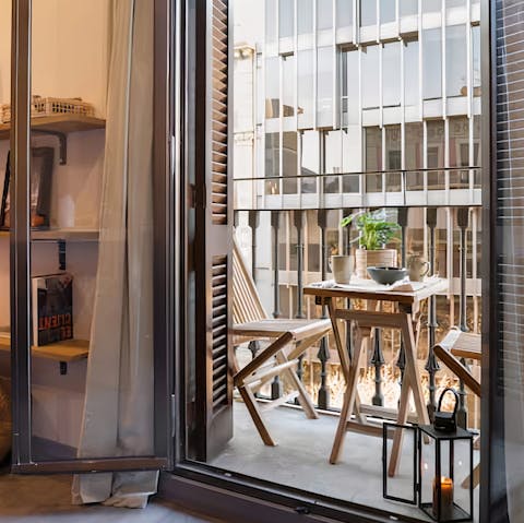 Sip an espresso on the sunny balcony, looking out to the Eixample streets