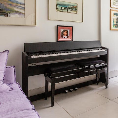 Entertain your guests with a tune on the upright grand piano