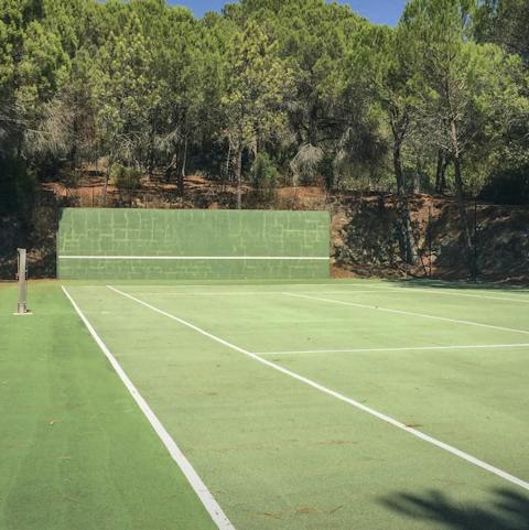Work up a sweat on the private tennis court