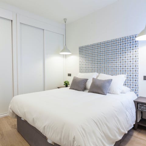 Sink into the comfy bed after a day of Madrid sightseeing