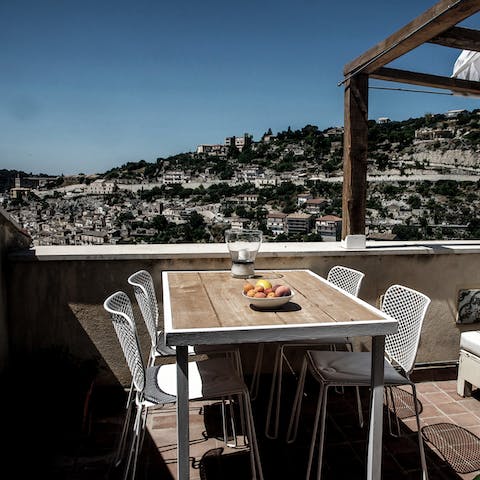 Marvel at panoramic views of Modica from your private balcony