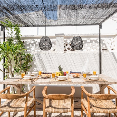 Tuck into homemade meals in the shade of the pergola