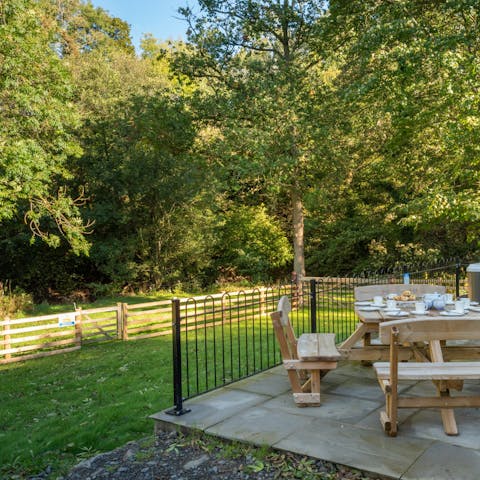 Fire up the barbecue as little ones run off some energy on the enclosed lawns