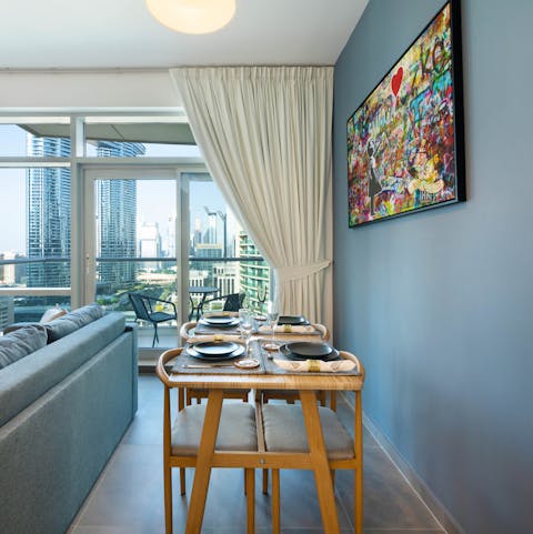 Tuck into dinners around the chic dining table while looking out at the view