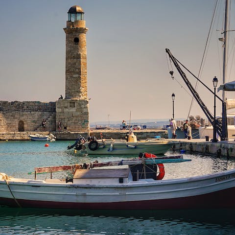 Drink and dine overlooking Rethymno's picturesque harbour, eight kilometres away