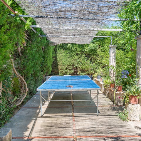 Enjoy a game of table tennis under the shade of the pergola