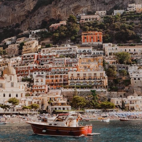 Stay in the heart of Positano, just steps from the beach and colourful buildings
