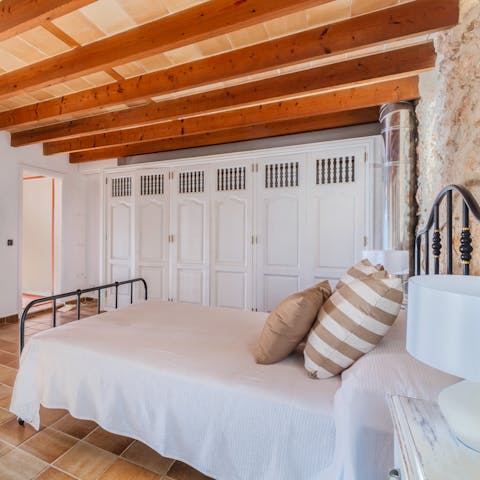 Sleep beneath beautifully beamed wooden ceilings