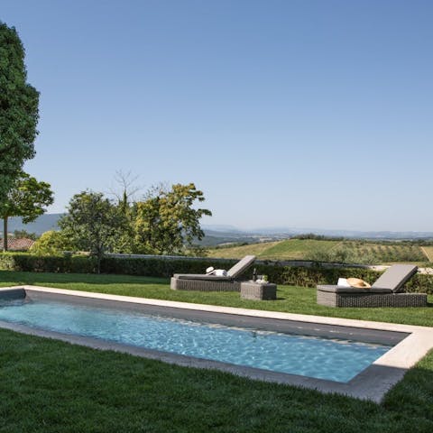 Enjoy incredible views across Chianti while relaxing by the pool
