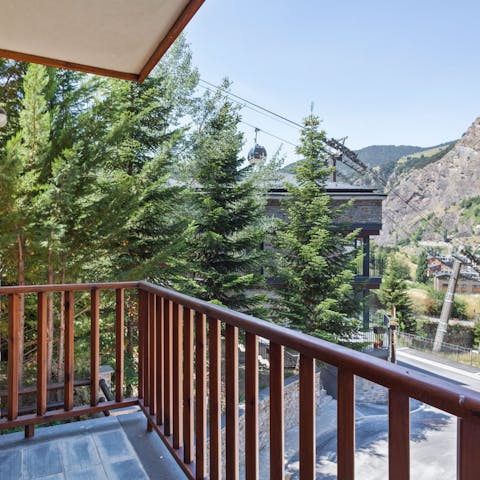 Step out onto the balcony and enjoy views of the surrounding mountains