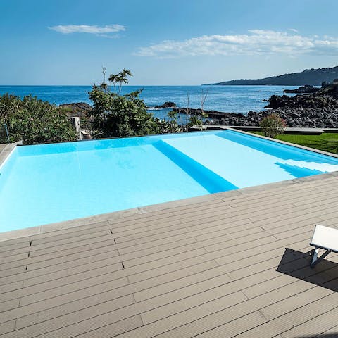 Dip your toes in the refreshing pool, overlooking the amazing scenery