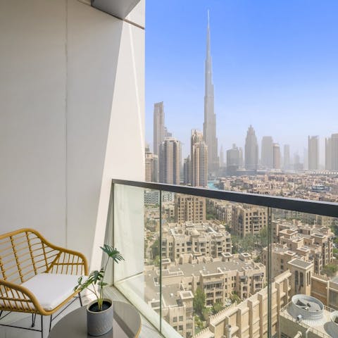 Admire the view of Dubai's incredible skyline from the home's balcony