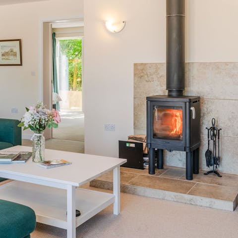 Curl up on the sofa by the wood-burner, a glass of wine in hand