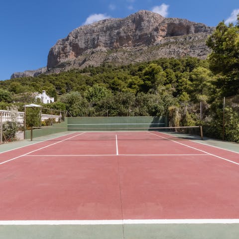 Play a spot of tennis with the mountain as your backdrop