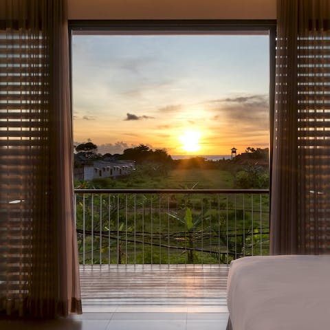 Take in the sunset views over the ocean from the balcony