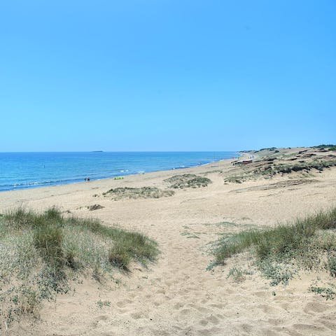 Enjoy serene coastal walks along Corfu's sandy beaches