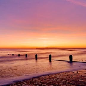Watch magical sunsets from the shore of Camber Sands, just a five-minute walk away