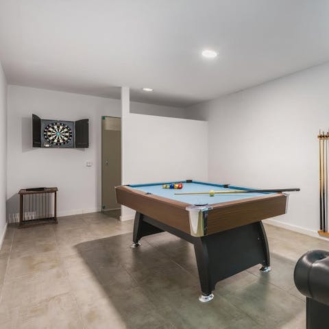Enjoy a game of pool with loved ones in the games room