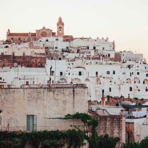 Explore the historic white-washed streets of Ostuni – a ten-minute drive