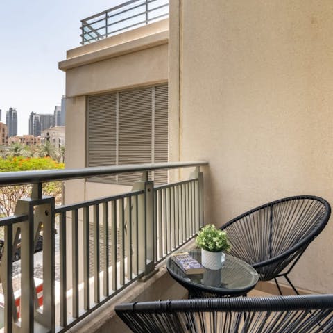 Savour your morning coffee on the sunny balcony, looking out to the iconic Dubai city skyline