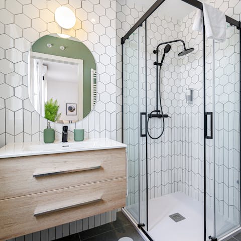 Start mornings with a luxurious soak beneath the tiled bathrooms' rainfall showers
