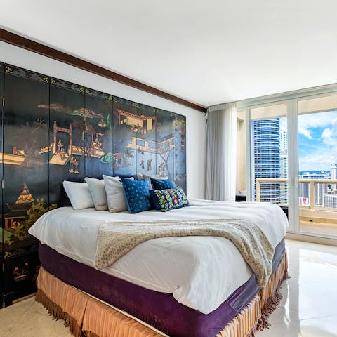 Wake up to ocean views from the Asian-inspired master bedroom
