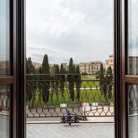 Gaze out at views of the manicured gardens of Piazza Magione from the balcony