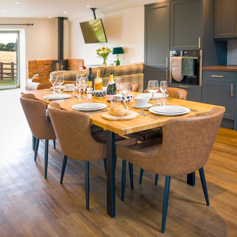 Gather around the dining table and indulge in a fabulous home-cooked meal, created in your sleek kitchen