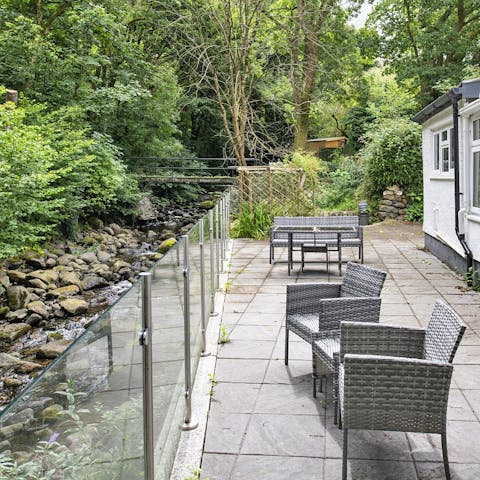 Enjoy an alfresco meal as the river runs by