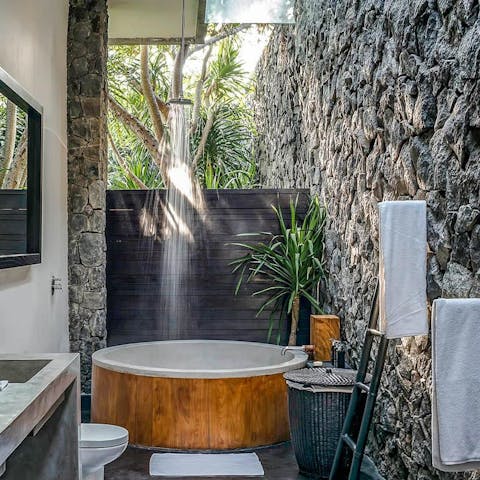 Bathe amid nature of the bathroom's tropical setting 