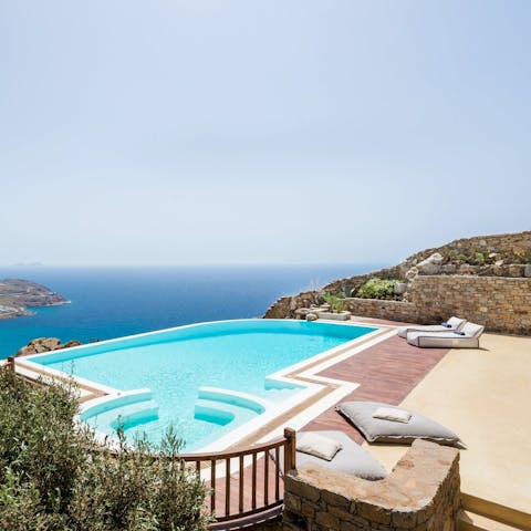 Enjoy uninterrupted views of the Aegean Sea from the comfort of the infinity pool or hot tub
