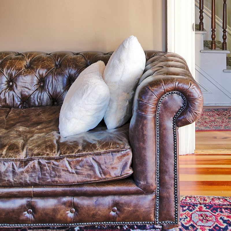 Sink into the gorgeous leather Chesterfield