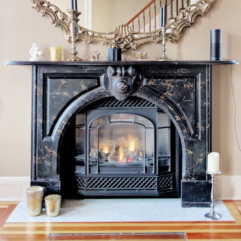 Cosy up around the gas fireplace
