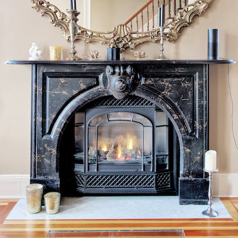 Cosy up around the gas fireplace