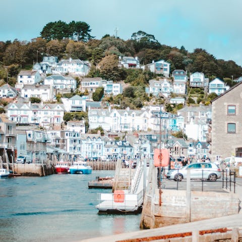 Wander around bustling Looe Harbour, an eighteen-minute walk away