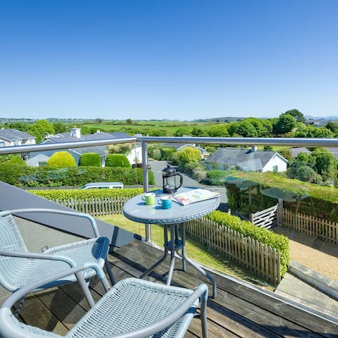 Admire views over the green countryside surroundings from the balcony