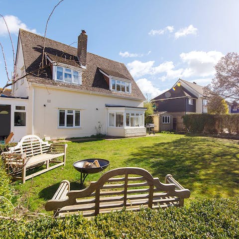 Light the fire pit and toast marshmallows in the back garden one evening