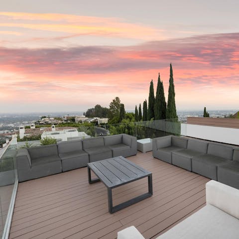 Catch the sunset light up the sky over LA from the rooftop terrace