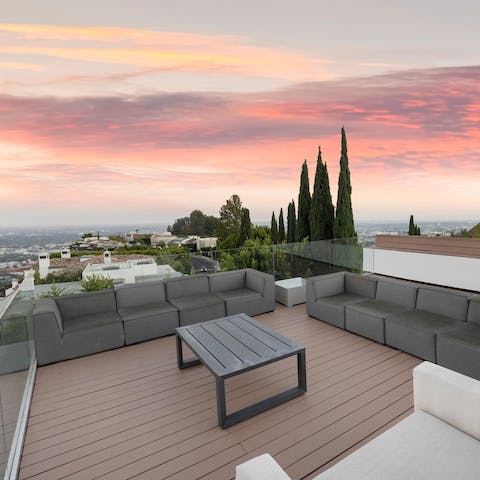 Catch the sunset light up the sky over LA from the rooftop terrace