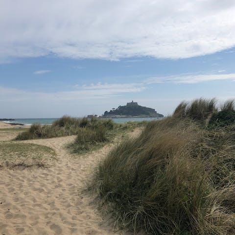 Sink your toes in the sand at scenic Marazion Beach, a twelve-minute walk away