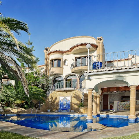 Relax by the pool in the mid-day Mediterranean sun