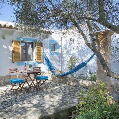Take a load off in this hammock tucked away in a quiet part of the garden – someone pass the wine
