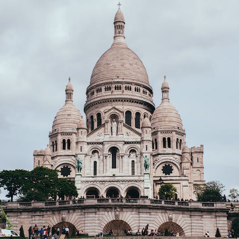 Take in the beauty of the Sacré-Cœur Basilica, a twenty-minute walk from your home