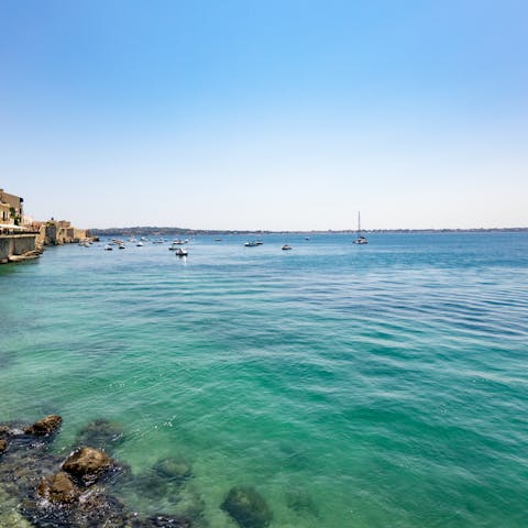 Take a four minute stroll down to Cala Rossa Beach