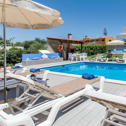 Laze on the poolside loungers after a day of discovering Vilamoura