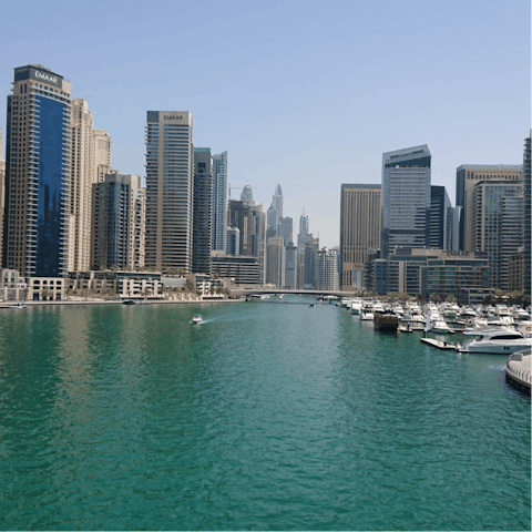 Explore Dubai Marina's promenade, shops and waterfront restaurants